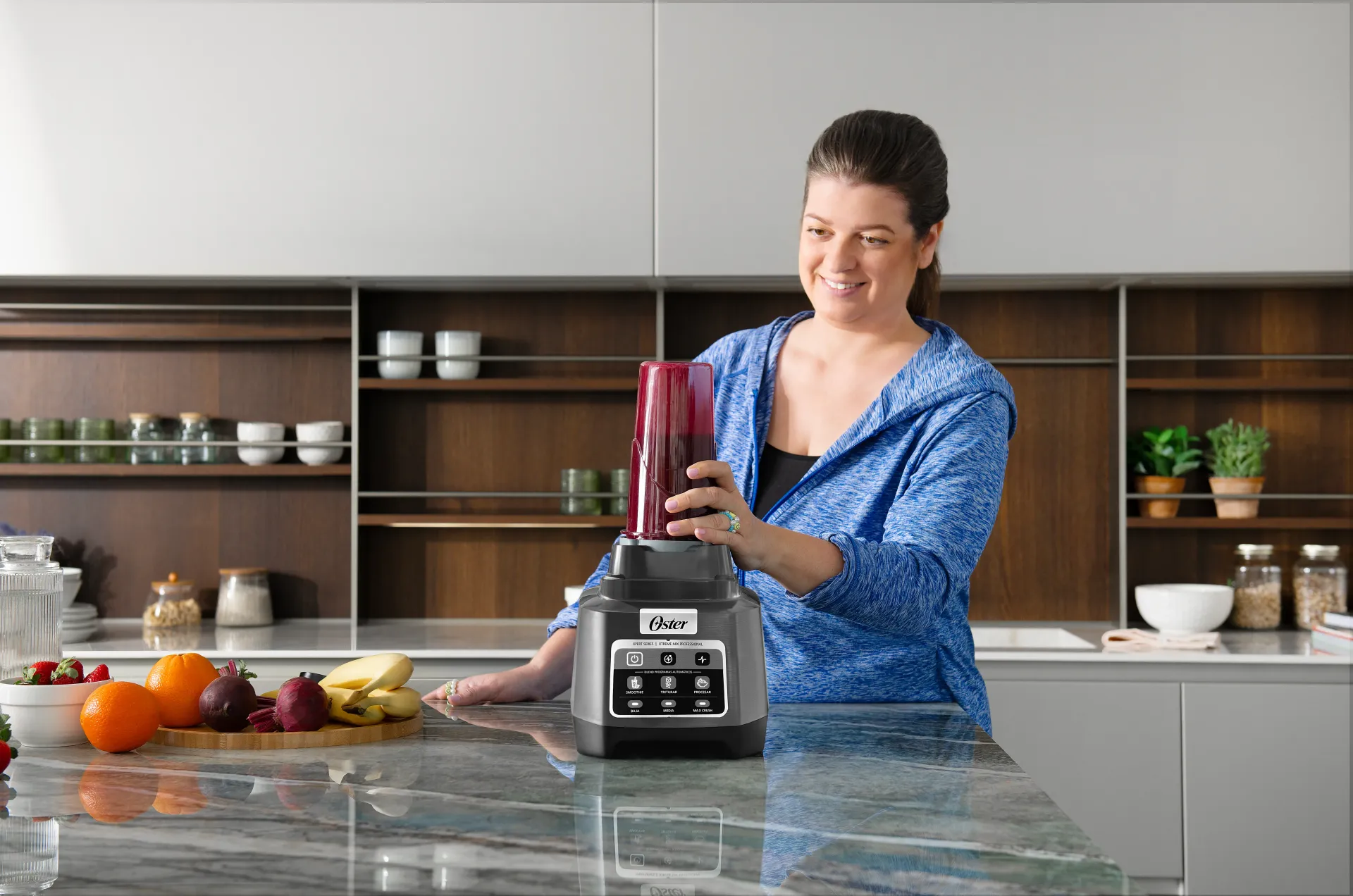 Group of people enjoying smoothies in kitchen