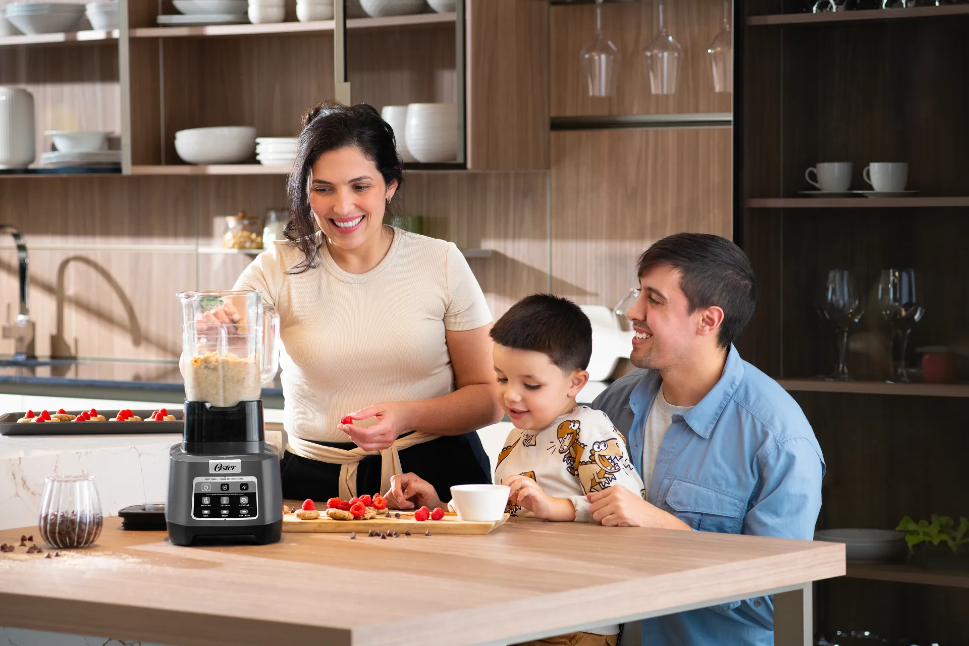 Man adding ingredients to Oster blender