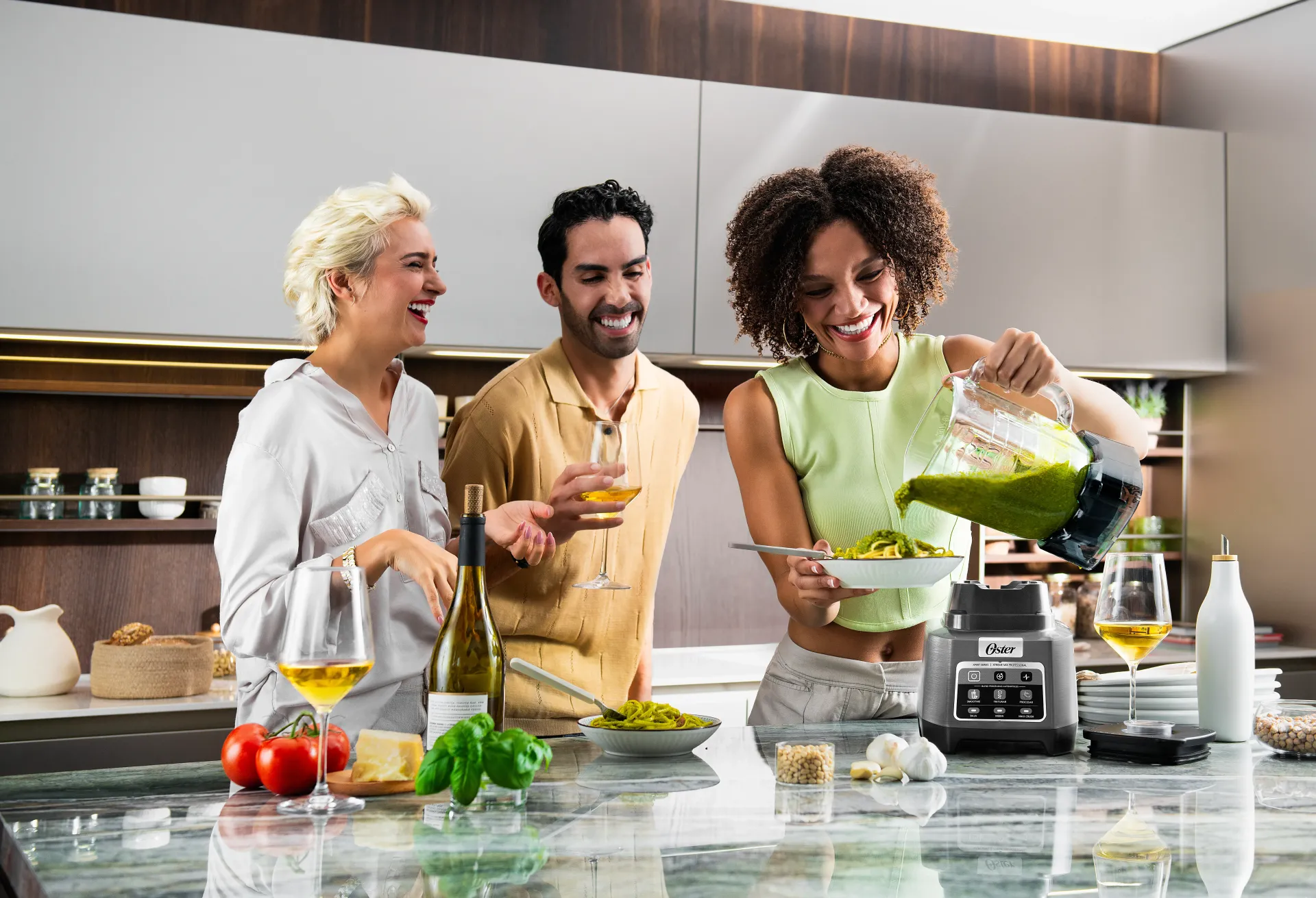 Man holding smoothie from Oster blender